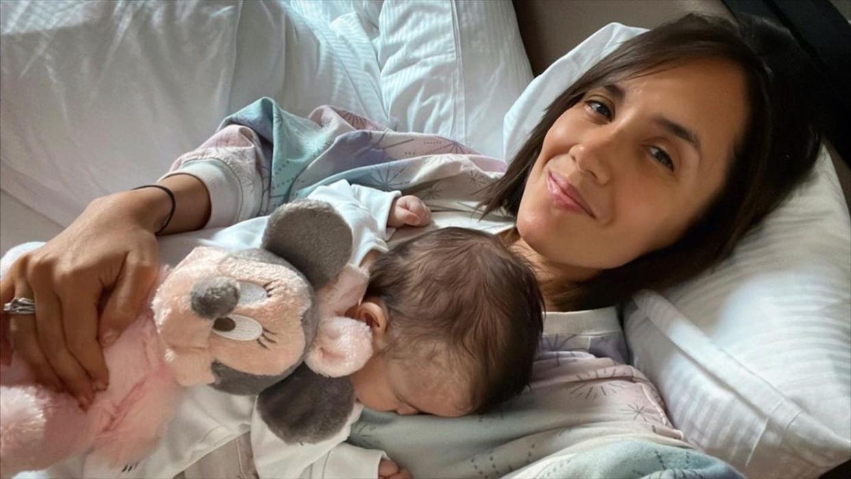 janette manrara cuddling baby lyra at home 