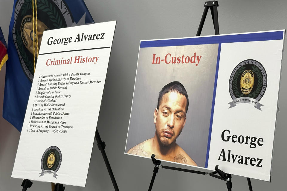 Poster boards regarding George Alvarez stand during a news conference on Monday, May 8, 2023, in Brownsville, Texas. The driver of an SUV that crashed into a crowd of people at a bus stop in Brownsville, killing eight, has been charged with manslaughter, police said Monday. Authorities believe Alvarez lost control after running a red light Sunday morning and plowed into a crowd outside a migrant center. (AP Photo/Valerie Gonzalez)