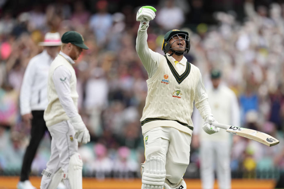 Australia's Usman Khawaja celebrates making 100 runs against South Africa during the second day of their cricket test match at the Sydney Cricket Ground in Sydney, Thursday, Jan. 5, 2023. (AP Photo/Rick Rycroft)