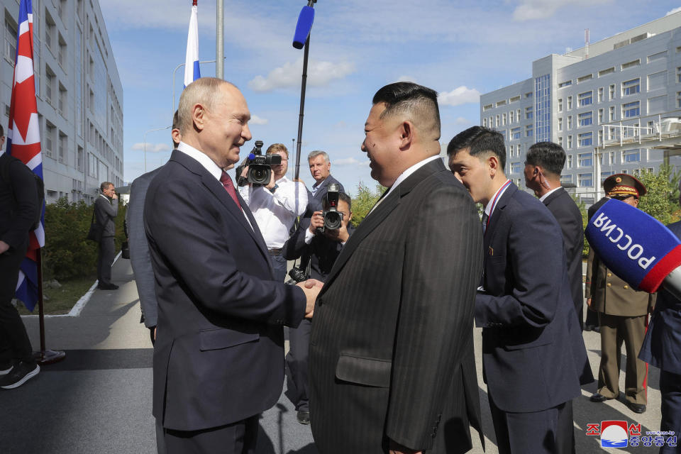 In this photo provided by the North Korean government, Russian President Vladimir Putin, left, and North Korean leader Kim Jong Un shake hands as they meet at the Vostochny cosmodrome outside the city of Tsiolkovsky, about 200 kilometers (125 miles) from the city of Blagoveshchensk in the far eastern Amur region, Russia, Wednesday, Sept. 13, 2023. Independent journalists were not given access to cover the event depicted in this image distributed by the North Korean government. The content of this image is as provided and cannot be independently verified. Korean language watermark on image as provided by source reads: "KCNA" which is the abbreviation for Korean Central News Agency. (Korean Central News Agency/Korea News Service via AP)