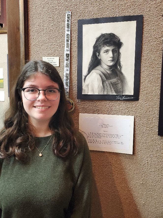 Vera Armenio poses with her artwork "Anastasia," which took second place in the Beaver County High School Senior Art Competition. Armenio attends Freedom High School.