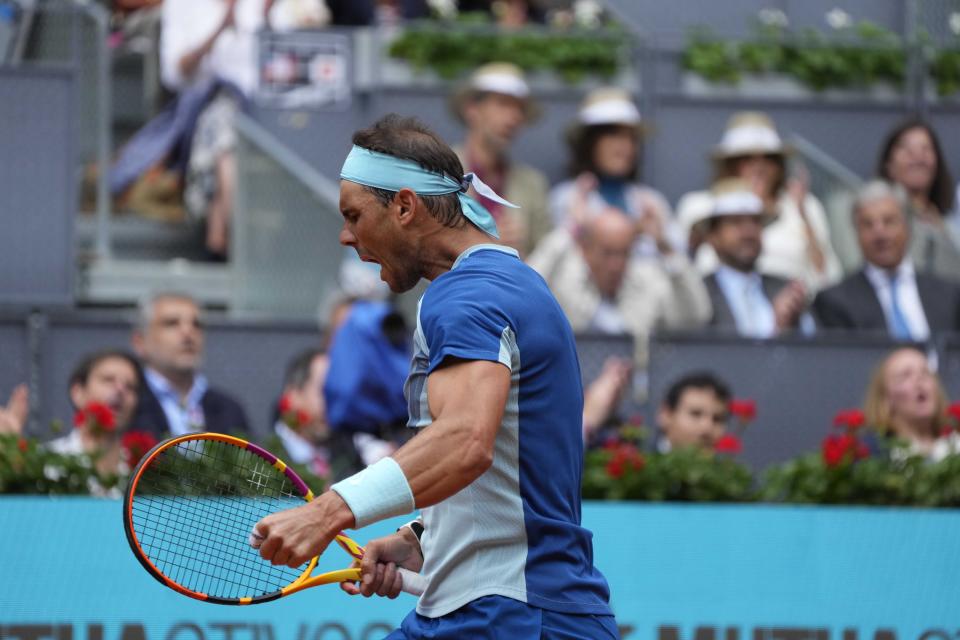 Rafael Nadal of Spain celebrates a winning point against Miomir Kecmanovic of Serbia during their match at the Mutua Madrid Open tennis tournament in Madrid, Spain, Wednesday, May 4, 2022. (AP Photo/Paul White)