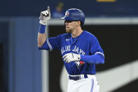 Toronto Blue Jays' Bradley Zimmer gestures toward the dugout after hitting a double against the Cincinnati Reds during the fifth inning of a baseball game Friday, May 20, 2022, in Toronto. (Jon Blacker/The Canadian Press via AP)