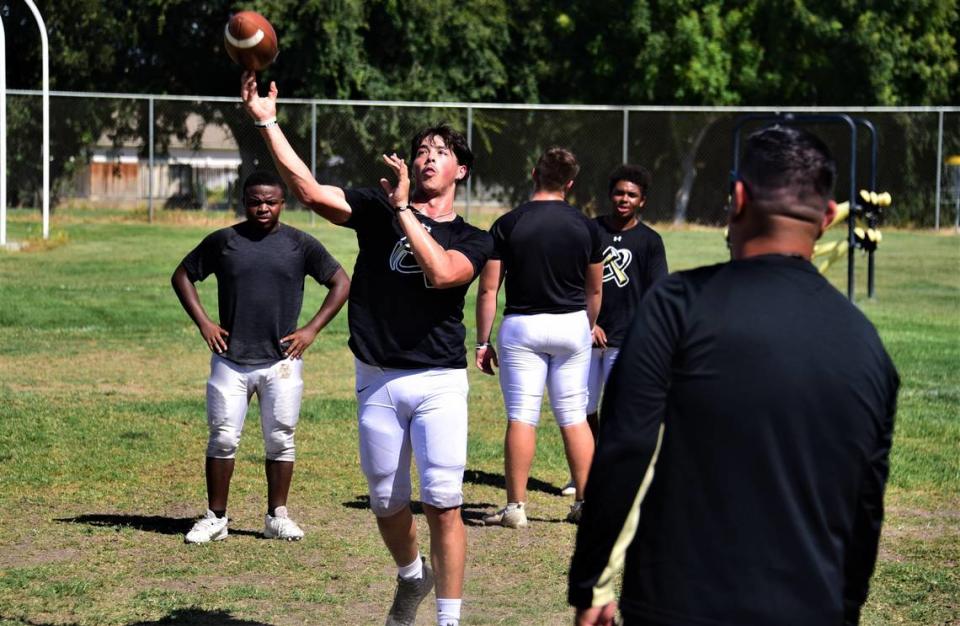 Buhach Colony High School quarterback PJ Curran throws a pass during practice on Tuesday, Aug. 15, 2023 in Atwater, Calif.