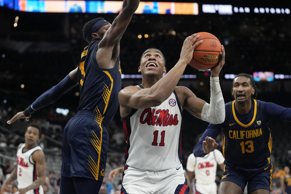 Mississippi guard Matthew Murrell (11) looks to shoot past California guard Keonte Kennedy, left, during the second half of an NCAA college basketball game in San Antonio, Saturday, Dec. 16, 2023. (AP Photo/Eric Gay)