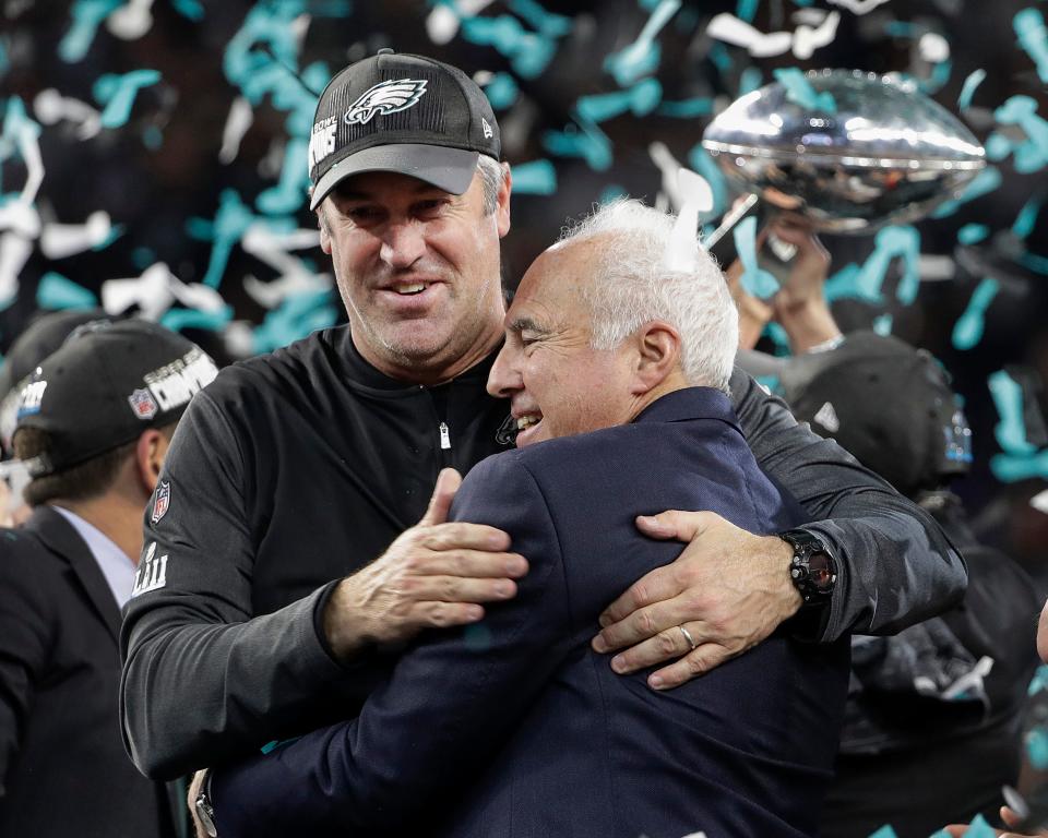 Eagles coach Doug Pederson (left) and owner Jeffrey Lurie celebrate winning Super Bowl LII over the Patriots in Minneapolis.