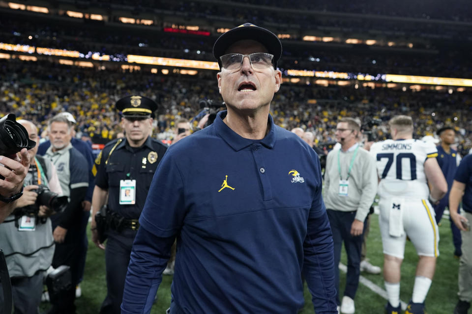 Michigan head coach Jim Harbaugh walks off the field after the Big Ten championship NCAA college football game against Iowa, Saturday, Dec. 2, 2023, in Indianapolis. Michigan won 26-0. (AP Photo/Darron Cummings)