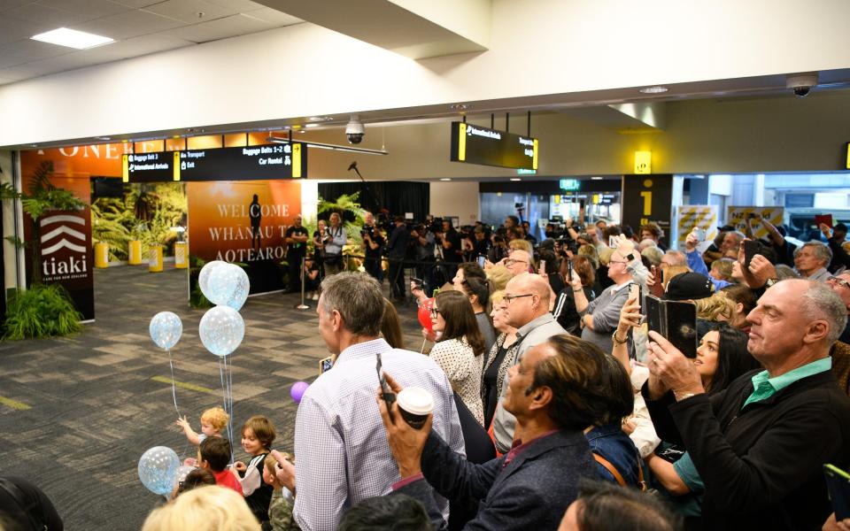 people at airport - Getty