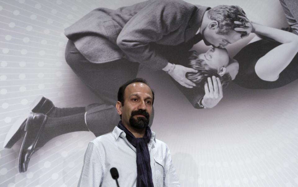 FILE - In this May 17, 2013 file photo, Director Asghar Farhadi arrives for a press conference for "The Past" at the 66th international film festival, in Cannes, southern France. Four of the five directors of Golden Globe-nominated foreign-language films, Paolo Sorrentino, "A Great Beauty," Abdellatif Kechiche, "Blue Is the Warmest Color," Thomas Vinterberg, "The Hunt," and Farhadi, "The Past," gather in Hollywood for a panel symposium on their films nominated for Best Foreign Language Film at The Egyptian Theatre on Saturday, Jan. 11, 2014. Hayao Miyazaki, whose film, "The Wind Rises" is also nominated in the same category, is unable to attend. (AP Photo/Virginia Mayo, File)