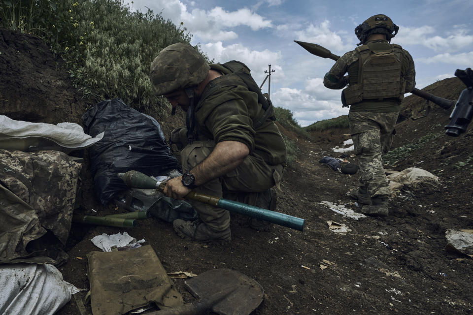 Ukrainian soldiers prepare to fire a rocket-propelled grenade at Russian positions at the front line near Bakhmut in the Donetsk region of Ukraine on Monday, May 22, 2023. Analysts say Moscow has learned from its mistakes so far in Ukraine and has improved its weapons and skills. (AP Photo/Libkos, File)