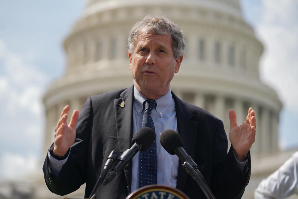 Sen. Sherrod Brown, D-Ohio, holds a press conference in September. He has voiced concerns about abuses of the H-1B system, and is co-sponsoring a bill aimed at reining in fraud.