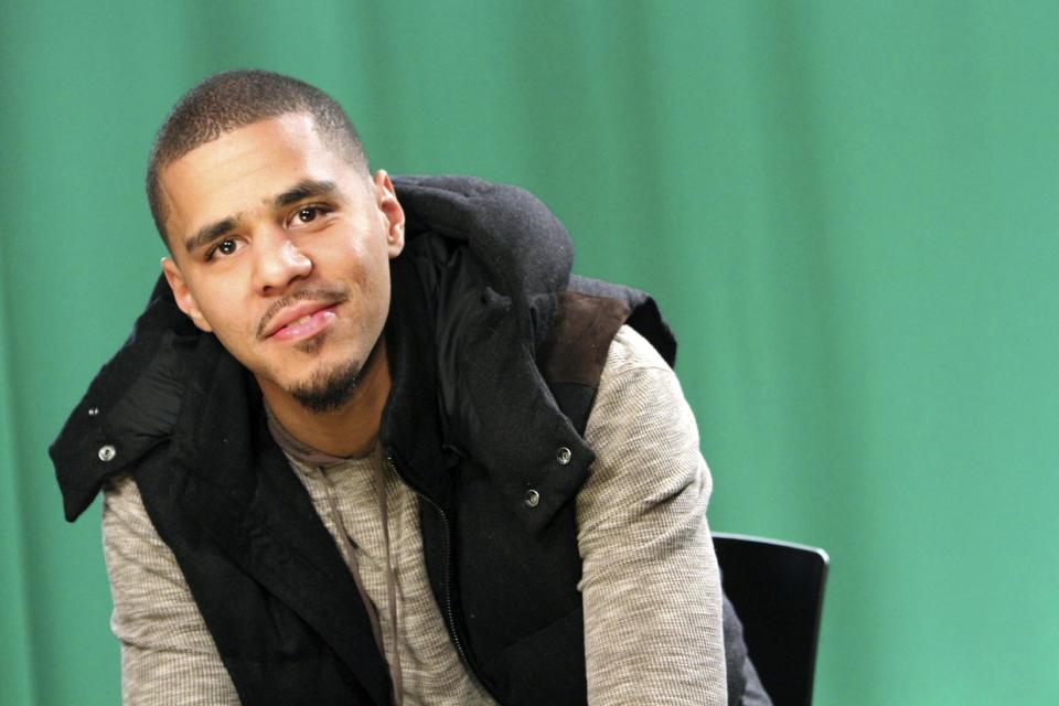 FILE - In this Jan. 27, 2012 file photo, rapper J. Cole poses for a portrait in New York. There were a lot of great songs on Cole's "Born Sinner," but he takes it to another level with Kendrick Lamar guesting on "Forbidden Fruit," a throwback ode to A Tribe Called Quest. This song serves as Cole's "Control," the song Lamar used to announce his greatness. (AP Photo/Mary Altaffer, File)