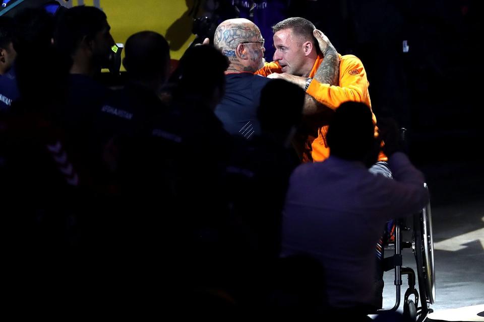 Edwin Vermetten of the Netherlands embraces Paul Guest of the United Kingdom after being presented the Above and Beyond Award.