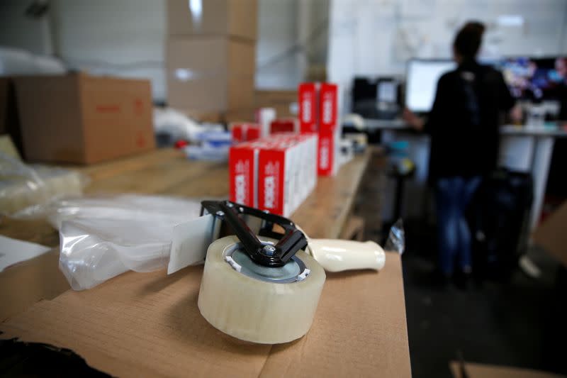 An employee prepares an order for Amazon at Porona warehouse in Bruay-sur-l'Escaut