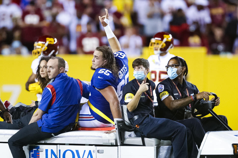 LANDOVER, MARYLAND - SEPTEMBER 16: Nick Gates #65 of the New York Giants exits the game following an injury during the first quarter against the Washington Football Team at FedExField on September 16, 2021 in Landover, Maryland. (Photo by Rob Carr/Getty Images)