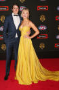 Candice sporting Hawthorn yellow on the red carpet