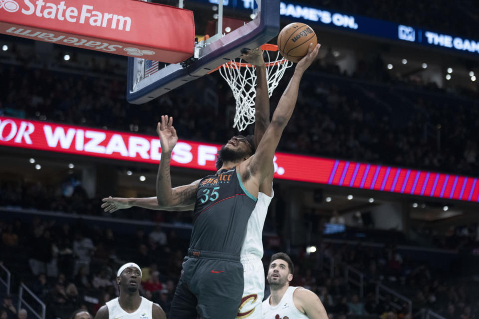 Washington Wizards forward Marvin Bagley III (35) shoots while Cleveland Cavaliers forward Evan Mobley, back, defends during the first half of an NBA basketball game in Washington, Sunday, Feb. 25, 2024. (AP Photo/Manuel Balce Ceneta)