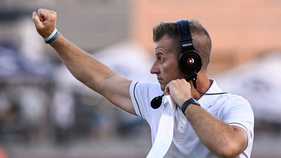 Central Valley Christian Head Football Coach Mason Hughes directs his team against Ripon Christian in a non-league high school football game on Friday, August 18, 2023.