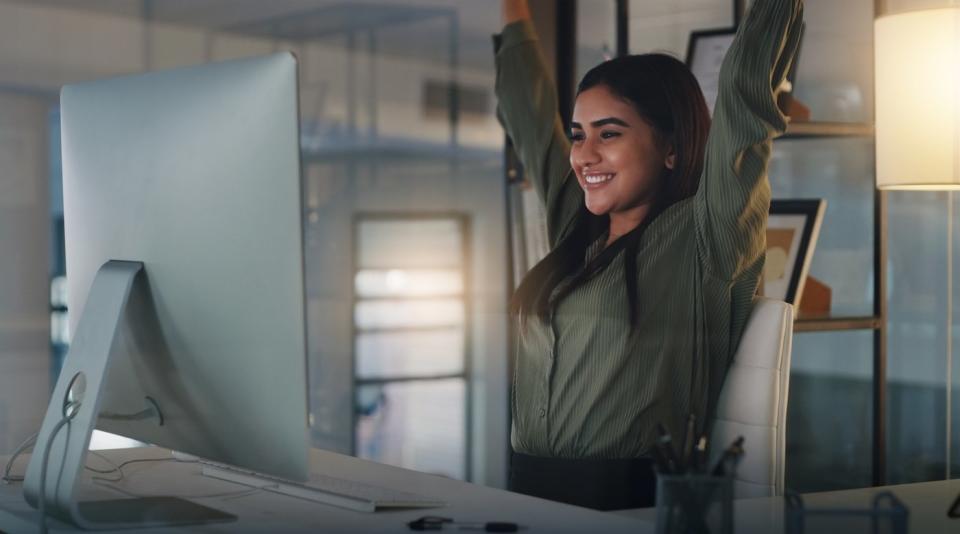 Someone celebrating what she's seeing on her screen.