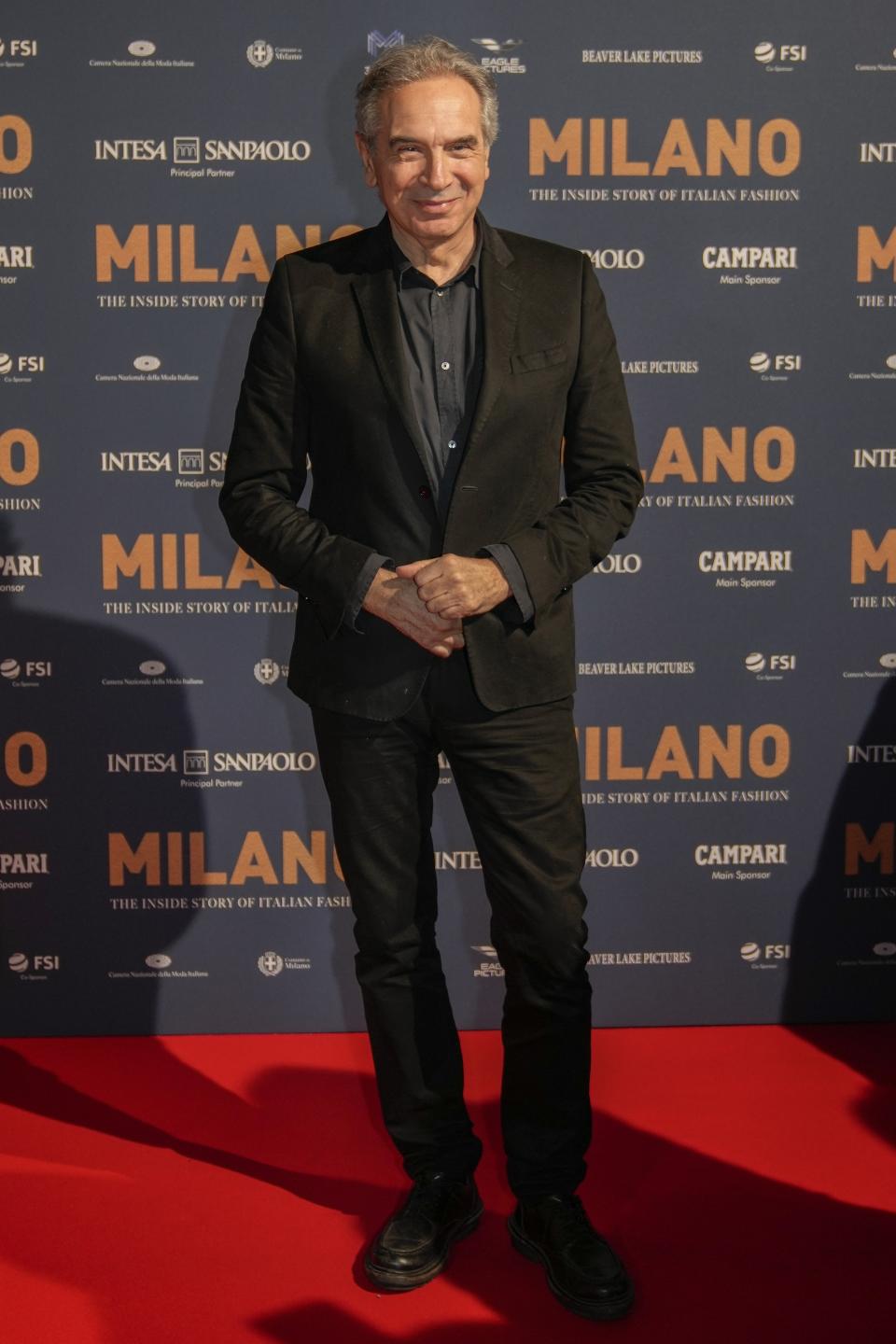 Carlo Capasa poses for photographers upon arrival for the premiere of the film 'Milano, the inside story of Milan Fashion' in Milan, Italy, Sunday, Feb. 26, 2023. (AP Photo/Luca Bruno)