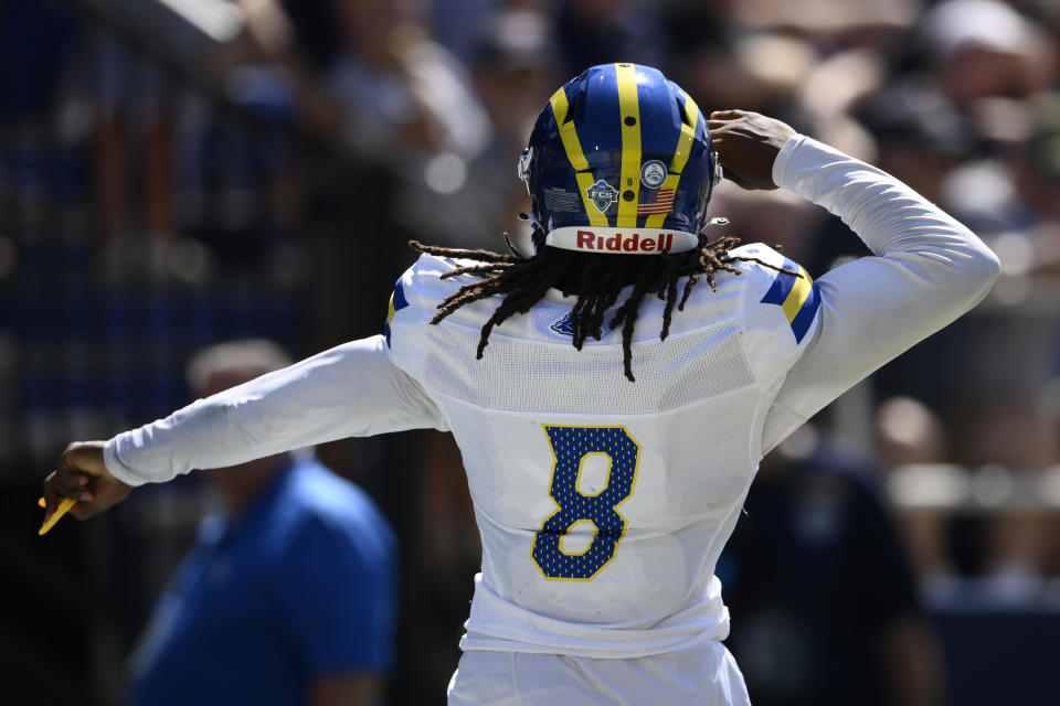 Delaware wide receiver Chandler Harvin (8) celebrates his touchdown during the second half of an NCAA college football game against Navy, Saturday, Sept. 3, 2022, in Annapolis, Md. Delaware won 14-7. (AP Photo/Nick Wass)