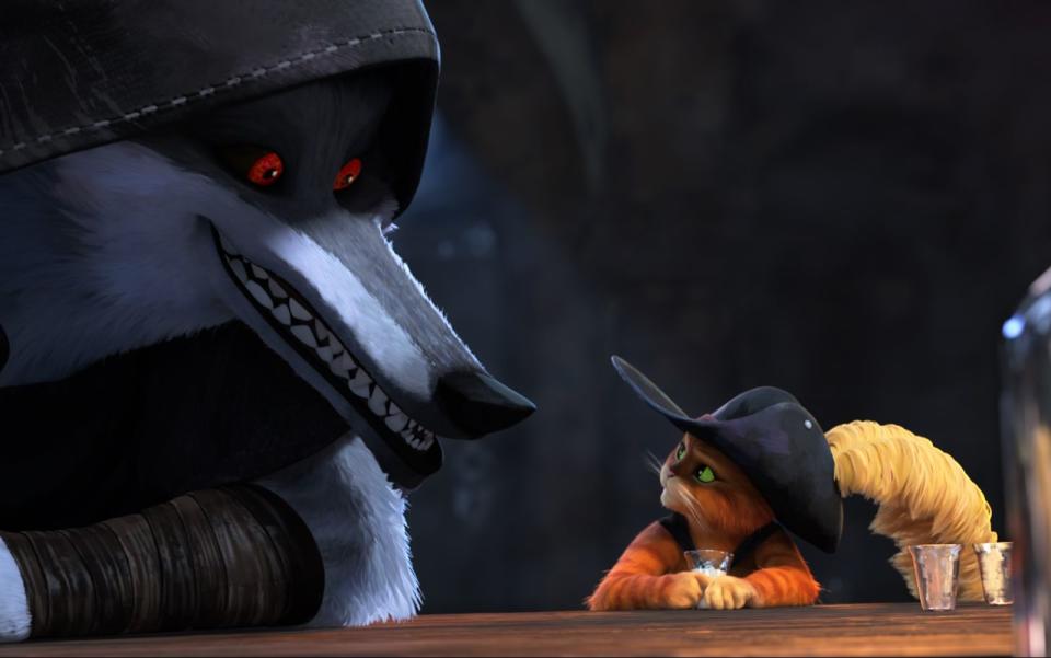 Dem Typen ist nicht zu trauen: Der gestiefelte Kater trifft in seinem neuen Film auf den großen bösen Wolf, einen Kopfgeldjäger. (Bild: 2022 Dreamworks Animation)