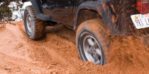 <p>When your wheels start to spin but before you've dug in too deep, use traction mats to get a grip. You can slide them under the wheel, giving you the stable surface to roll out of a jam.</p>