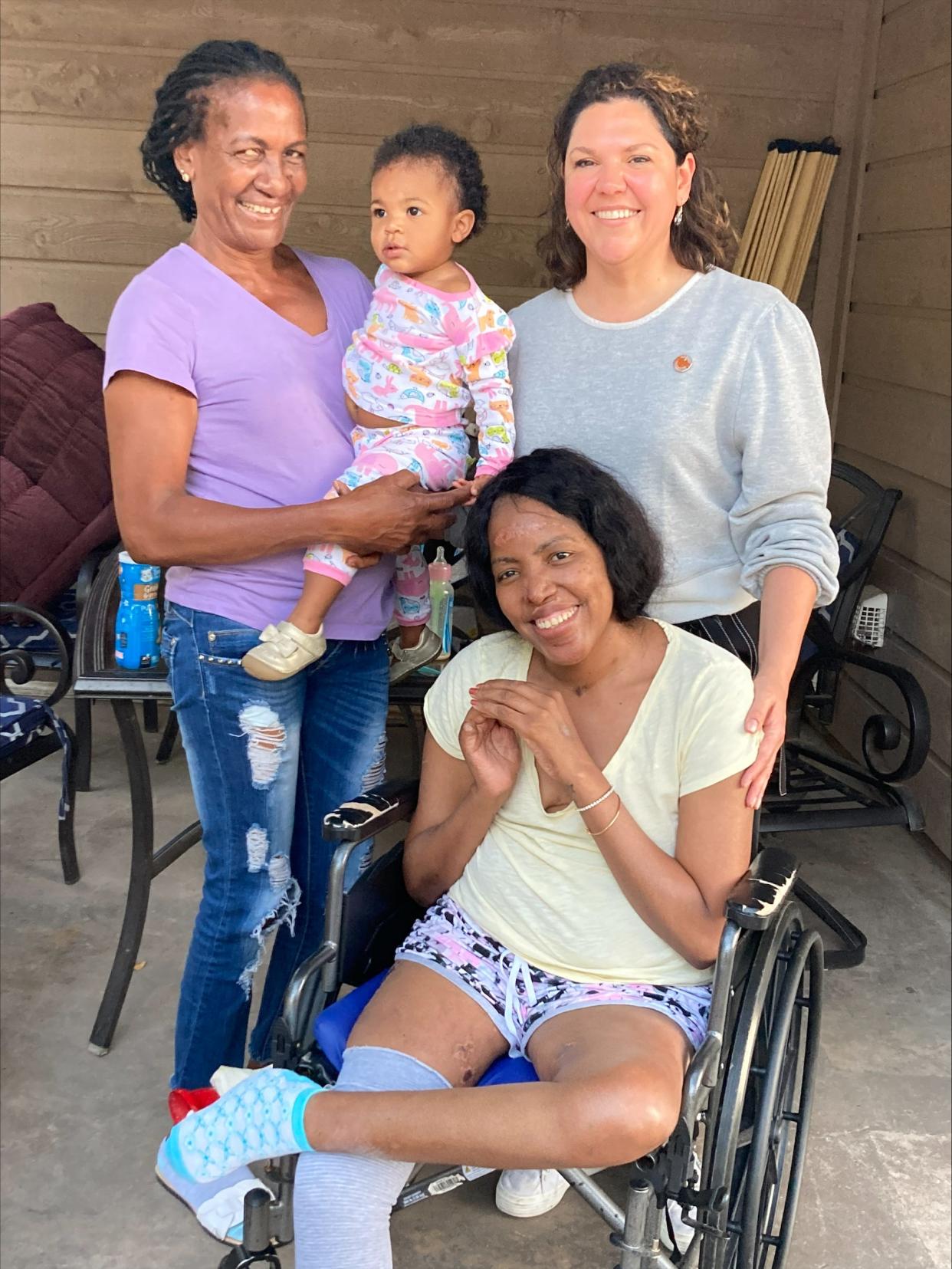 Community health worker Brenda Garza, right, helped Maidelys Hernandez, seated, reconnect with her mother Josefina Gasso and her daughter Elif as Hernandez was recovering from multiple health issues after giving birth. Hernandez was in the hospital from May 8, 2021, to Dec. 13, 2021, and then in rehab until July 20. She needed multiple amputations including one to her leg.
