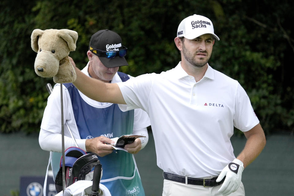 Patrick Cantlay pulls his driver from the bag on the second tee during the first round of the BMW Championship golf tournament, Thursday, Aug. 17, 2023, in Olympia Fields, Ill. (AP Photo/Charles Rex Arbogast)