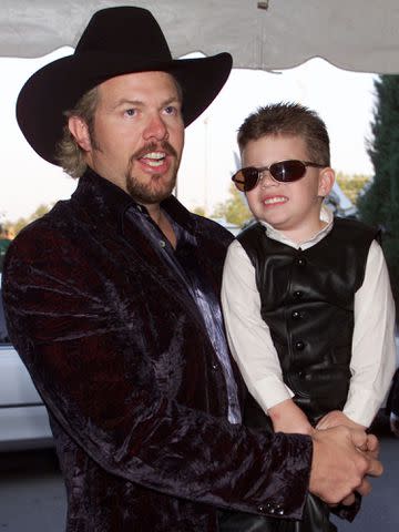 <p>Frank Micelotta/Getty</p> Toby Keith and his son Stelen at the CMA Awards in Nashville in October 2000
