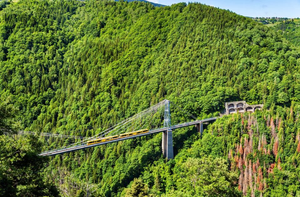 <p>Immediately recognisable by its cute little yellow carriages, this historic train has been transporting passengers high up into the rocky Pyrenees for over 100 years.</p><p>Starting out at the UNESCO walled city of Villefranche in France, the Little Yellow Train of the Pyrenees, or Le Petit Train Jaune, climbs up the Tet valley, past little mountain villages and over the arches of spectacular stone viaducts to take you high above the valleys and across the peaks.</p><p>Stopping at the historic fortress of Mont Louis, you’ll have panoramic views of the mighty Pyrenees, before the train continues on its route towards the Spanish border, finishing up just a few hundred metres short of it at Bourg-Madame.</p><p><strong>You can experience this unique train during Spanish mountain walking holiday with Good Housekeeping from £1,199 per person, with departures between May and September.</strong></p><p><a class="link " href="https://www.goodhousekeepingholidays.com/tours/catalonia-roses-pyrenees-walking-rail-tour" rel="nofollow noopener" target="_blank" data-ylk="slk:FIND OUT MORE">FIND OUT MORE</a></p>