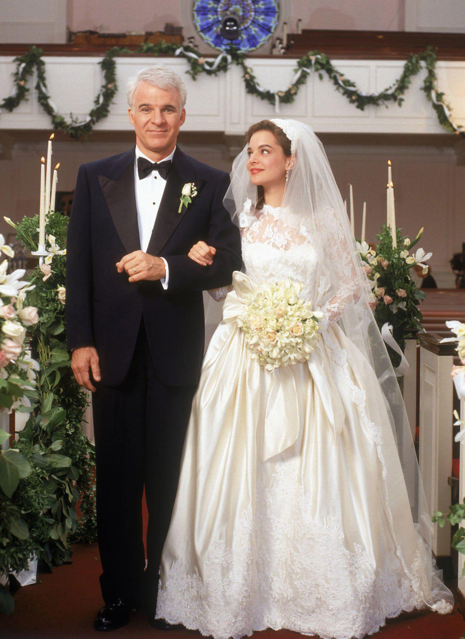 Martin as George Banks walking Kimberly Williams as Annie down the aisle in 