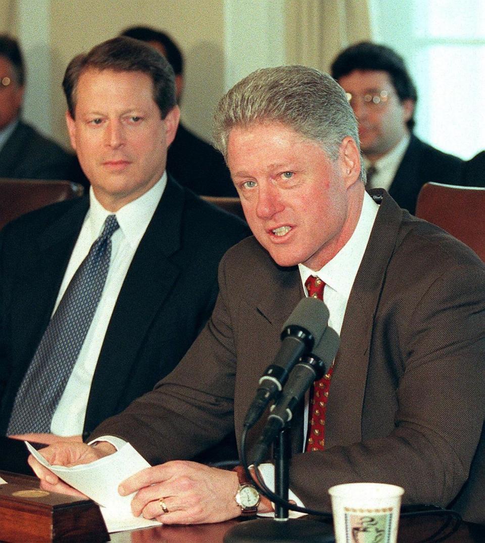 PHOTO: President Bill Clinton speaks to reporters as Vice President Al Gore looks on before the start of meetings at the White House 05 March in Washington, DC. (William Philpott/AFP via Getty Images)