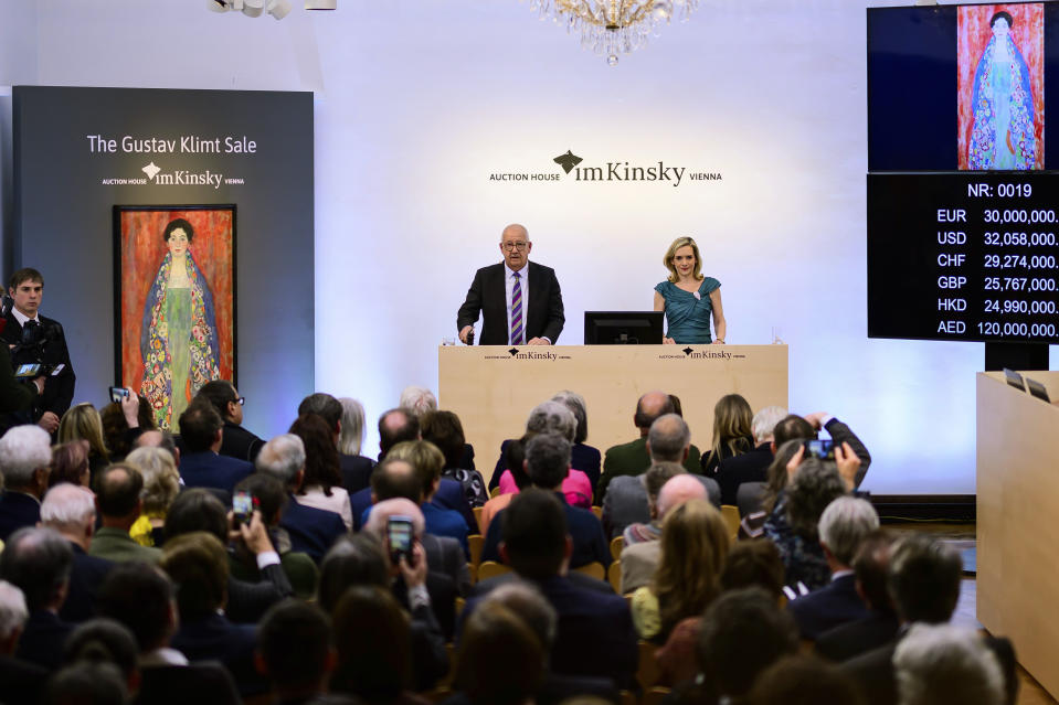 Auctioneer Michael Kovacek declares the sale of the painting 'Portrait of Fräulein Lieser' by Austrian painter Gustav Klimt during an auction, in Vienna, Wednesday, April 24, 2024. A portrait of a young woman by Gustav Klimt that was long believed to be lost has been sold at an auction in Vienna for 30 million euros ($32 million). The Austrian modernist artist started work on the “Portrait of Fräulein Lieser” in 1917, the year before he died, and it is one of his last works. (AP Photo/Christian Bruna)