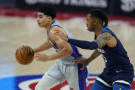 Detroit Pistons guard Killian Hayes drives as Minnesota Timberwolves guard D'Angelo Russell (0) defends during the second half of an NBA basketball game, Tuesday, May 11, 2021, in Detroit. (AP Photo/Carlos Osorio)