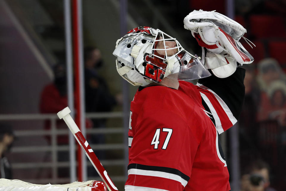 Carolina Hurricanes goaltender James Reimer (47) celebrates his win following the third period of an NHL hockey game against the Florida Panthers in Raleigh, N.C., Sunday, March 7, 2021. (AP Photo/Karl B DeBlaker)