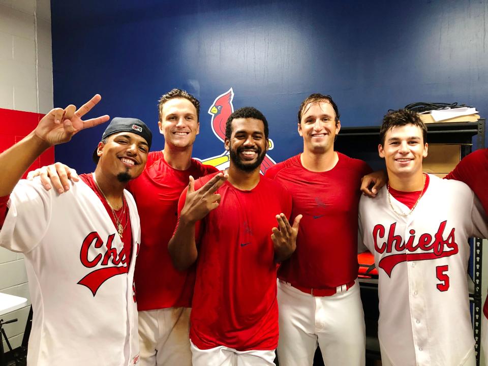 A few of the Peoria Chiefs players celebrate in the clubhouse after the high-A affiliate of the St. Louis Cardinals clinched its first Midwest League playoff spot since 2018, with a 3-0 victory over Beloit at Dozer Park on Wednesday, Sept. 6, 2023.