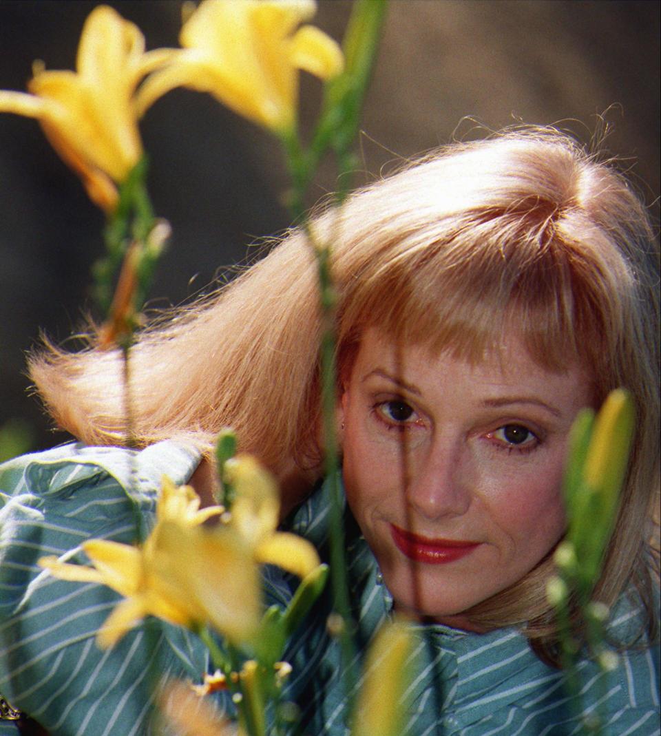 Actress/director Sondra Locke poses for a photograph Nov 1, 1997 at a garden in Beverly Hills, Calif. Locke is the author of the book: "The Good, The Bad and the Very Ugly" which details her 13-year relationship with actor Clint Eastwood. (AP Photo/ Damian Dovarganes)