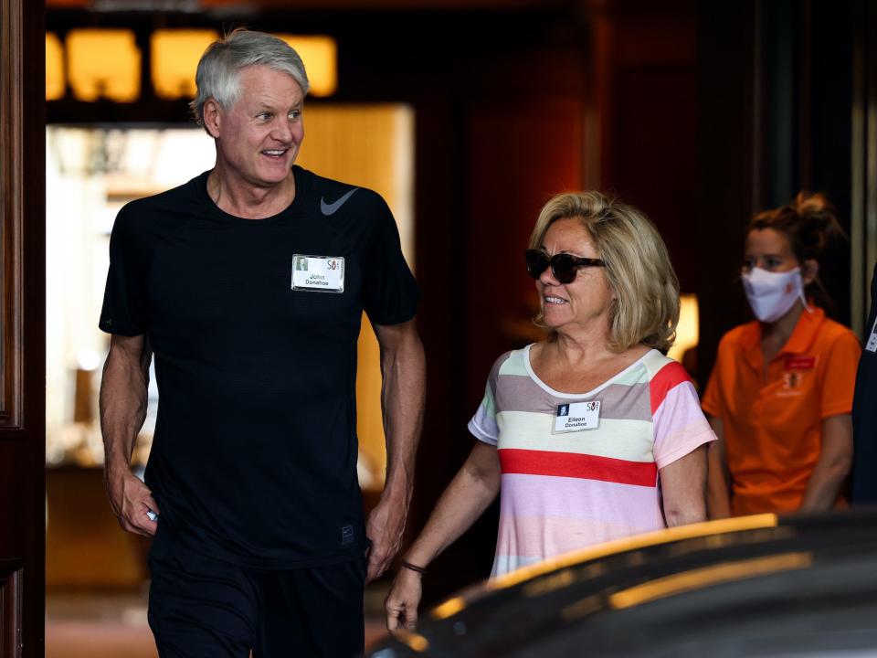 John Donahoe and his wife Eileen walk together