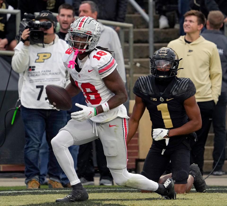 Oct. 14, 2023; Lafayette, In., USA;<br>Ohio State Buckeyes wide receiver Marvin Harrison Jr. (18) is tackled in the endzone by Purdue Boilermakers defensive back Markevious Brown (1) during the first half of Saturday’s NCAA Division I football game at Ross-Ade Stadium in Lafayette.