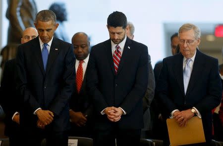 FILE PHOTO - U.S. President Barack Obama (L-R), House Speaker Paul Ryan (R-WI) and Senate Majority Leader Mitch McConnell (R-KY) bow their heads in prayer at the end of a ceremony commemorating the 150th anniversary of the 13th Amendment, which formally abolished slavery in the aftermath of the U.S. Civil War, at the U.S. Capitol in Washington December 9, 2015. REUTERS/Jonathan Ernst