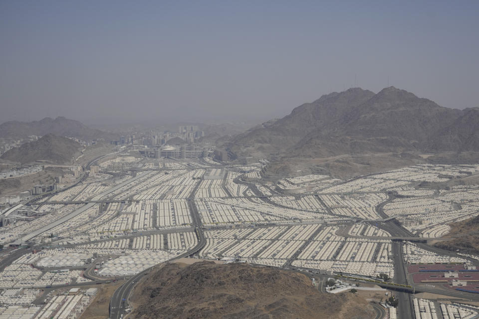 Tents for Muslim pilgrims fill the Mina tent camp during the hajj, in Mina, near the holy city of Mecca, Saudi Arabia, Monday, June 17, 2024. Muslim pilgrims used the early morning hours Monday to perform the second day of the symbolic stoning of the devil, as noontime summer heat caused heatstroke among thousands wrapping up the Hajj pilgrimage. (AP Photo/Rafiq Maqbool)