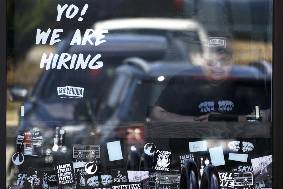 FILE - A hiring sign is displayed at a restaurant in Schaumburg, Ill., Friday, April 1, 2022. Labor Department releases weekly report on unemployment benefits on Thursday, Nov. 17. (AP Photo/Nam Y. Huh, File)