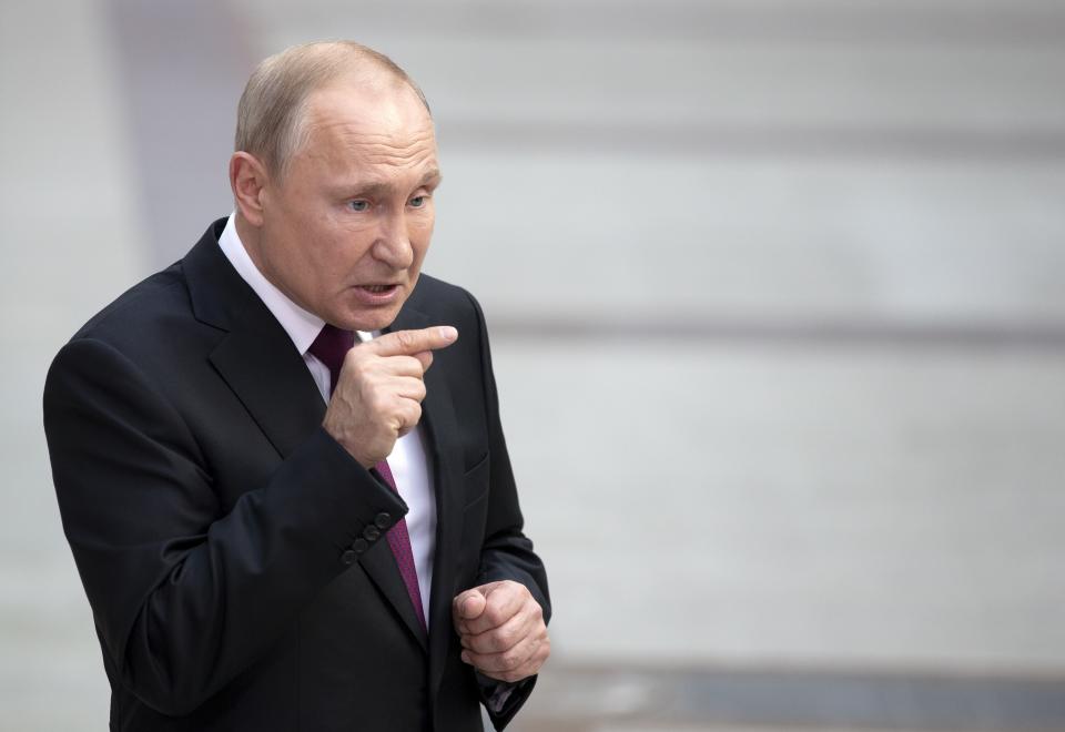 Russian President Vladimir Putin gestures answers a journalist's question after his annual call-in show in Moscow, Russia, Thursday, June 20, 2019. Putin hosts call-in shows every year, which typically provide a platform for ordinary Russians to appeal to the president on issues ranging from foreign policy to housing and utilities. (AP Photo/Alexander Zemlianichenko)