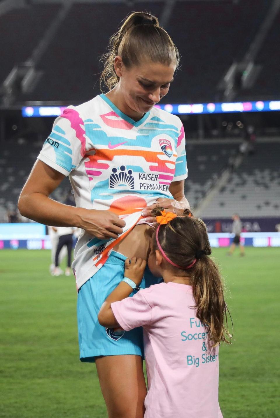 PHOTO: San Diego Wave FC's Alex Morgan with her daughter Charlie after the final game of her career on September 8, 2024 in San Diego. (Meg Oliphant/Getty Images)