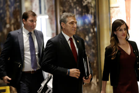 U.S. Representative Lou Barletta (R-PA) is escorted by Madeleine Westerhout as he arrives at Trump Tower to meet with U.S. President-elect Donald Trump in New York, U.S., November 29, 2016. REUTERS/Mike Segar