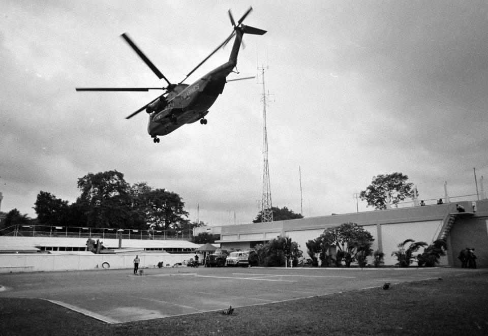 In this April 29, 1975 file photo, a helicopter lifts off from the U.S. embassy in Saigon, Vietnam during last minute evacuation of authorized personnel and civilians.