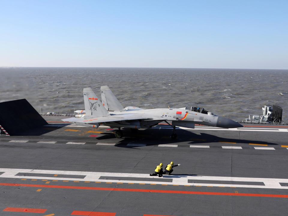 Chinese J-15 fighter jet preparing to take off from the deck of the Liaoning aircraft carrier during military drills in the Bohai Sea, off China's northeast coast.