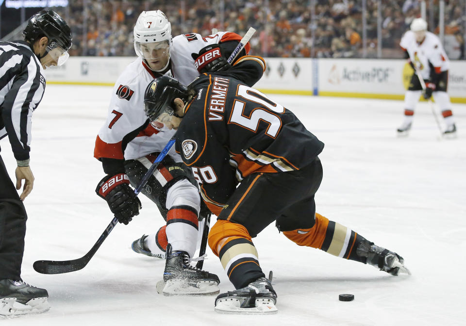 FILE - In this Dec. 11, 2016, file photo, Ottawa Senators center Kyle Turris (7) and Anaheim Ducks center Antoine Vermette (50) battle for position during a faceoff in the first period of an NHL hockey game in Anaheim, Calif. Vermette announced his retirement Thursday, Jan. 31, 2019, after playing 14 NHL seasons and establishing himself as one of the best faceoff men of his generation. (AP Photo/Alex Gallardo, File)