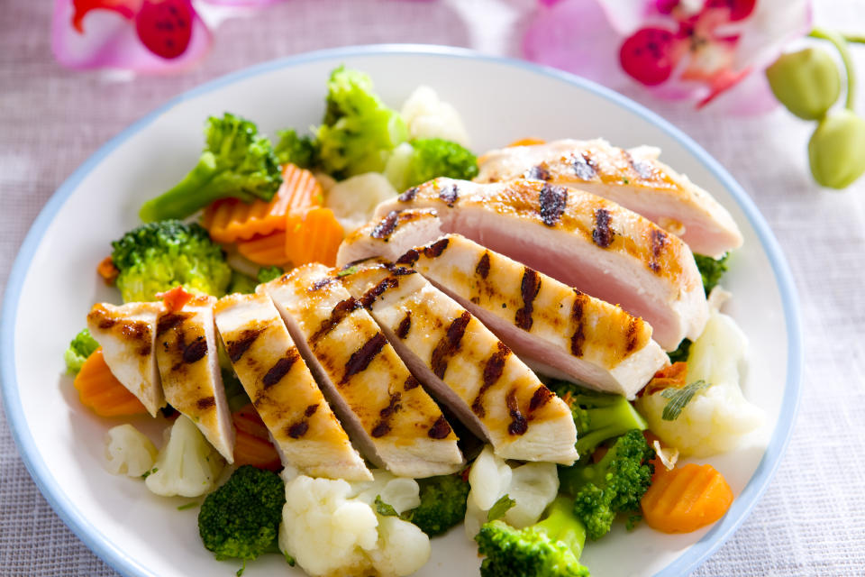 Picture of cooked chicken served with vegetables.